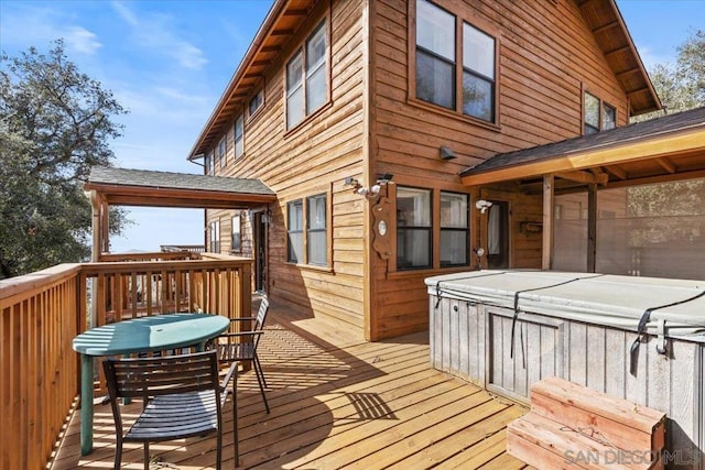 wooden terrace with a hot tub