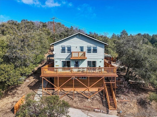 rear view of house with a wooden deck