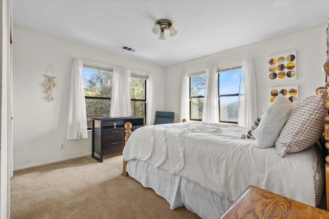 bedroom with light carpet