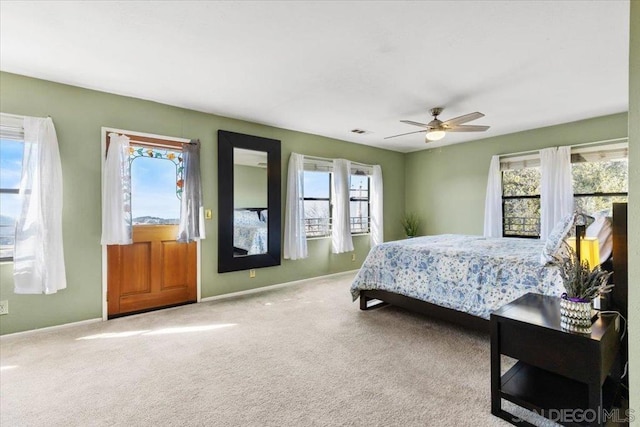 bedroom with ceiling fan and carpet flooring