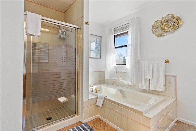 bathroom featuring separate shower and tub and tile patterned flooring