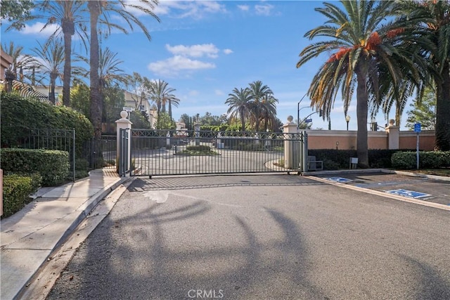 view of gate featuring fence