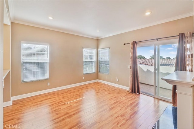 unfurnished room with crown molding and light hardwood / wood-style flooring