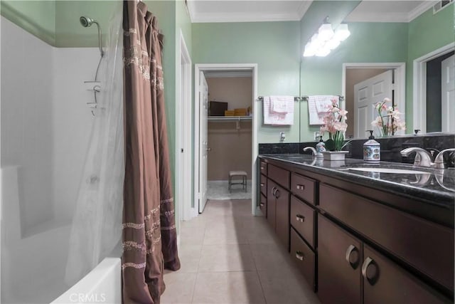 bathroom featuring tile patterned flooring, a shower with curtain, a sink, and ornamental molding