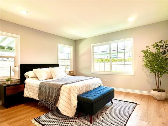 bedroom with light wood-type flooring