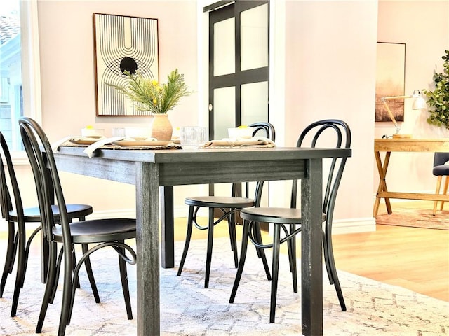 dining space featuring light hardwood / wood-style flooring