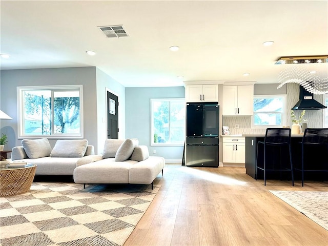 living room featuring light wood-type flooring