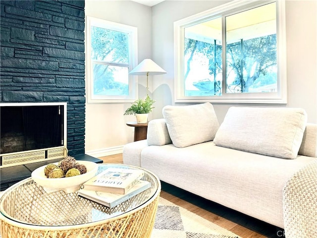 sitting room with hardwood / wood-style floors