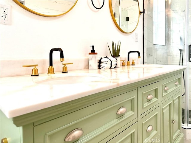 bathroom featuring vanity and a shower with shower door