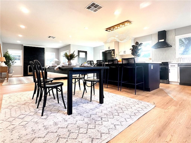 dining room with light hardwood / wood-style floors