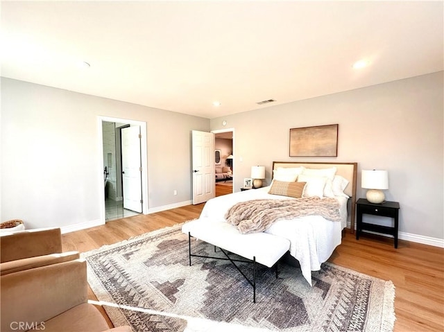 bedroom with hardwood / wood-style flooring