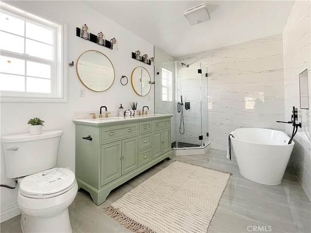 full bathroom featuring vanity, tile walls, independent shower and bath, and toilet