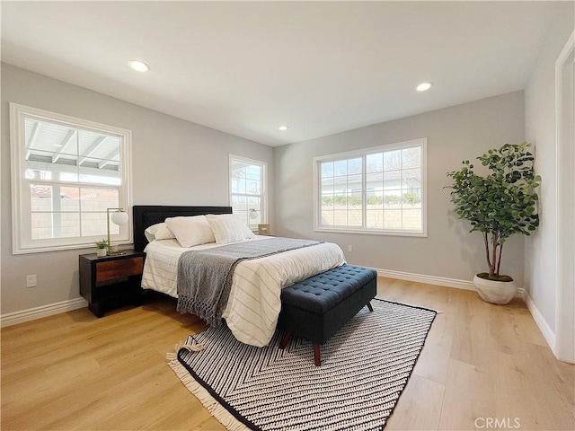 bedroom with light hardwood / wood-style flooring