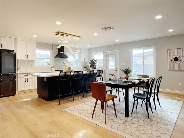 dining area with light wood-type flooring