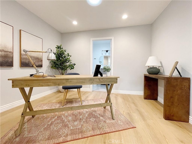 office area with light hardwood / wood-style flooring