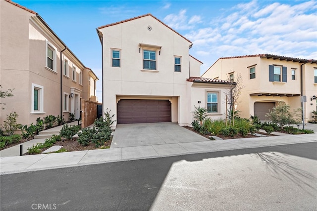 mediterranean / spanish-style home with a garage