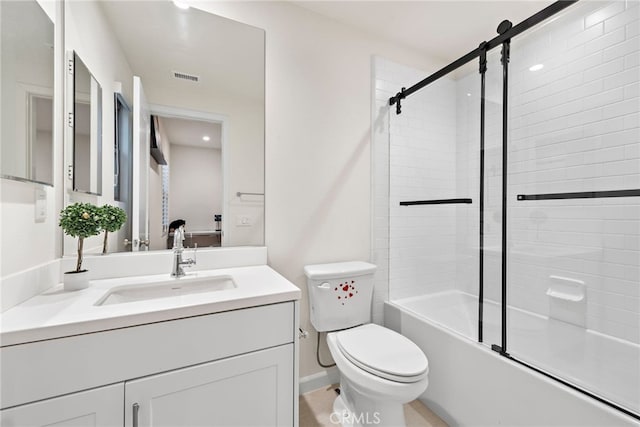 bathroom featuring visible vents, combined bath / shower with glass door, vanity, and toilet