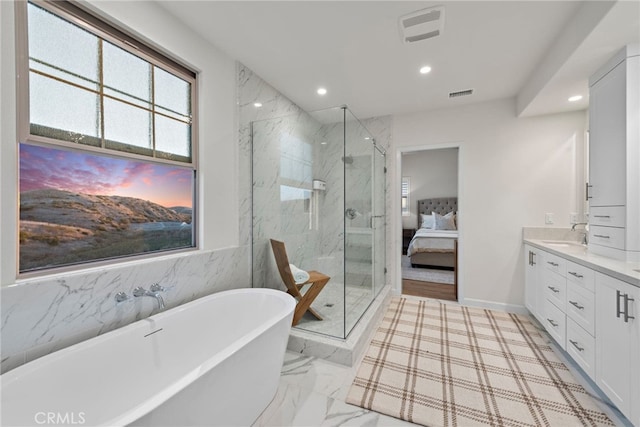 ensuite bathroom with marble finish floor, visible vents, vanity, and ensuite bathroom