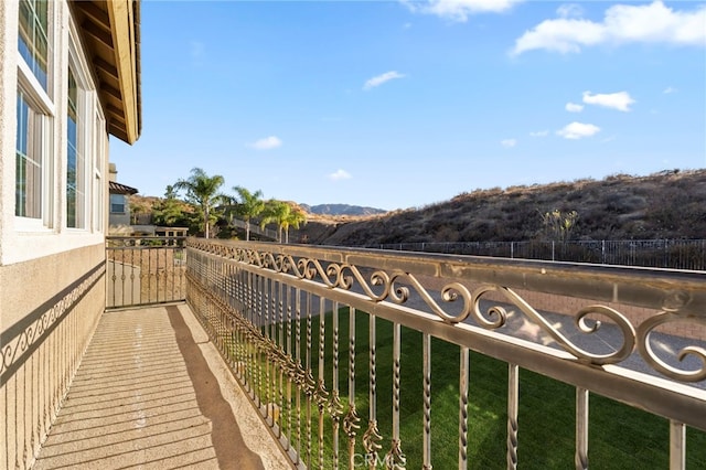 balcony featuring a mountain view