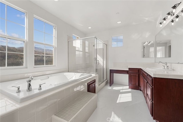 bathroom with vanity and plus walk in shower