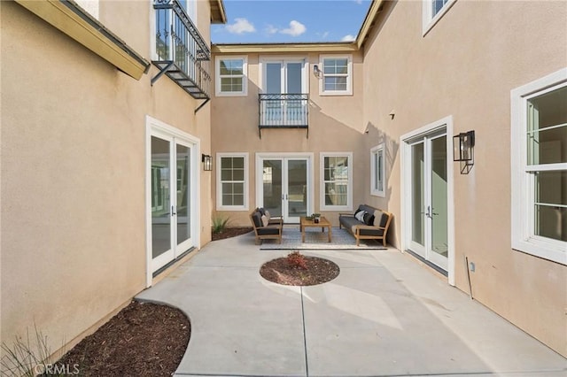 view of patio / terrace featuring french doors and an outdoor living space