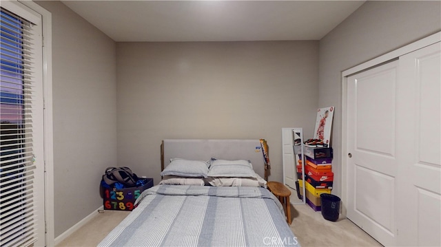 carpeted bedroom with a closet