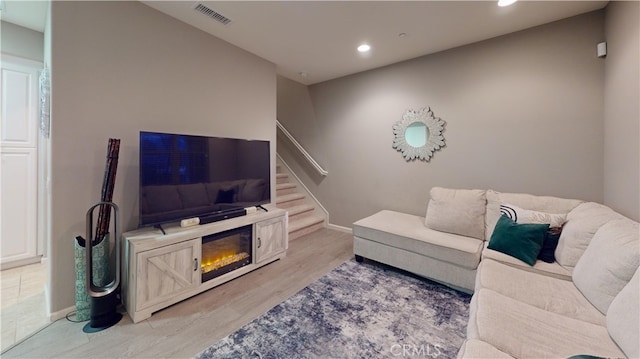 living room with light hardwood / wood-style flooring