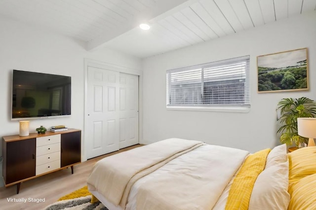 bedroom featuring light hardwood / wood-style flooring and a closet