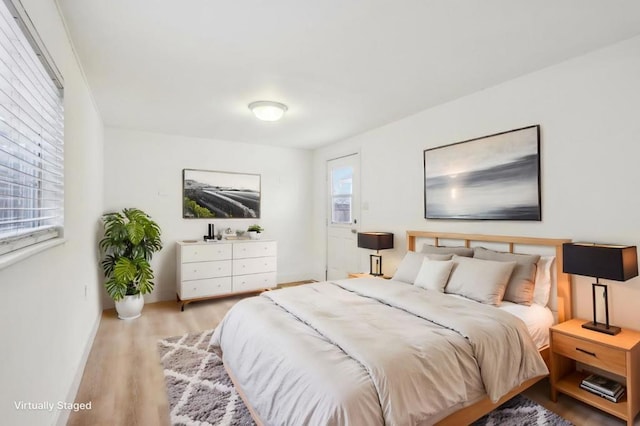 bedroom with light hardwood / wood-style floors