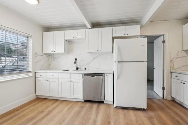 kitchen featuring sink, white refrigerator, dishwasher, beamed ceiling, and decorative backsplash