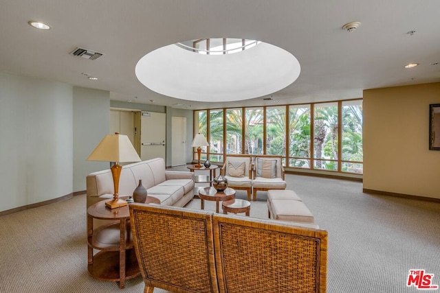 living room with floor to ceiling windows and carpet flooring