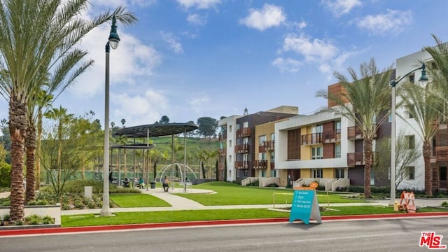 view of home's community with a lawn