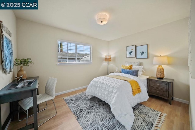 bedroom with light hardwood / wood-style floors