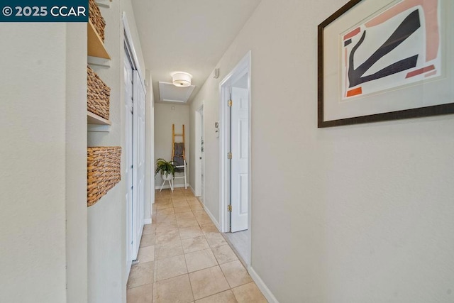 hall featuring light tile patterned floors