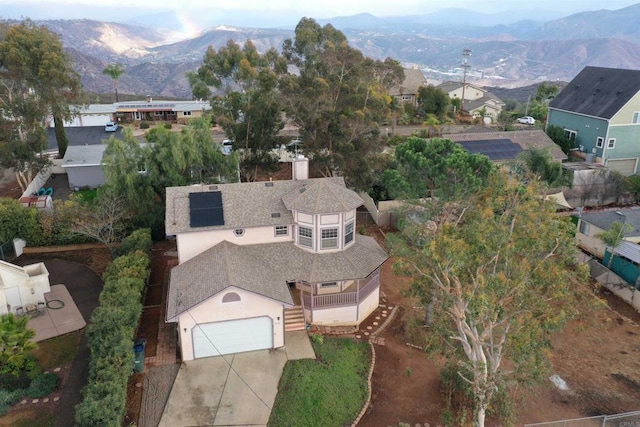 birds eye view of property featuring a mountain view