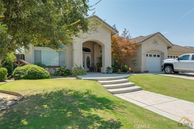 view of front of house with a garage and a front lawn