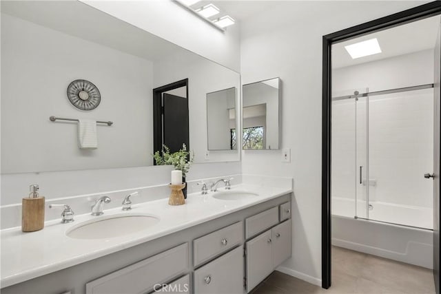 bathroom featuring tile patterned flooring, bath / shower combo with glass door, and vanity