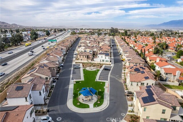 birds eye view of property featuring a mountain view