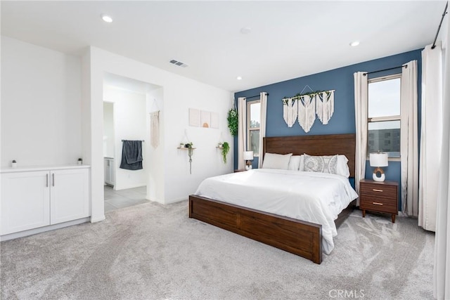 bedroom with light carpet