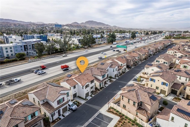 drone / aerial view featuring a mountain view