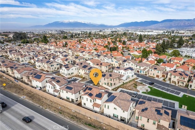 birds eye view of property featuring a mountain view