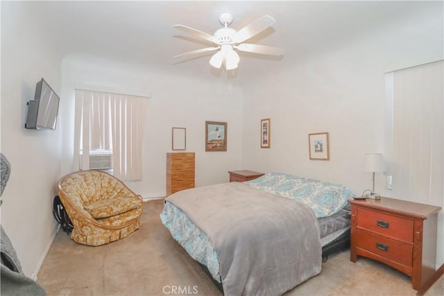 bedroom featuring ceiling fan and light carpet