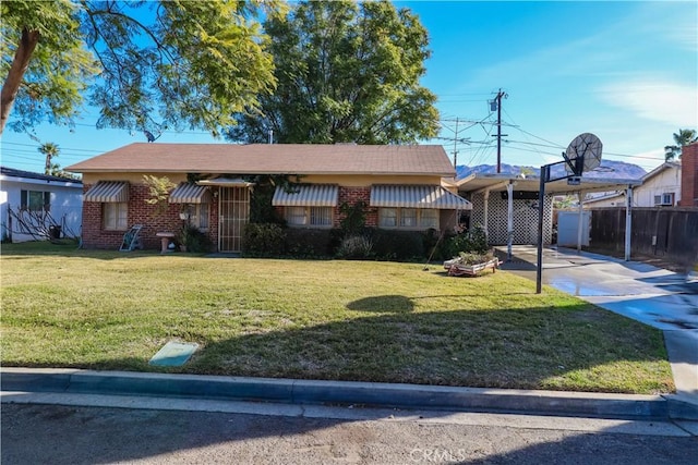 ranch-style house with a carport and a front lawn