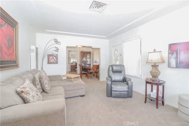 living room featuring light carpet