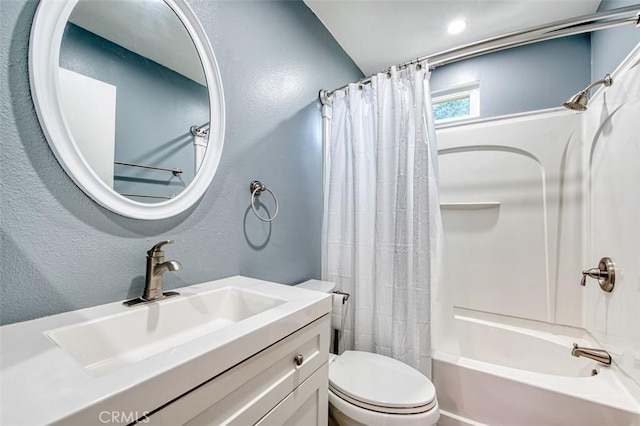 full bathroom with vanity, toilet, and shower / bath combo