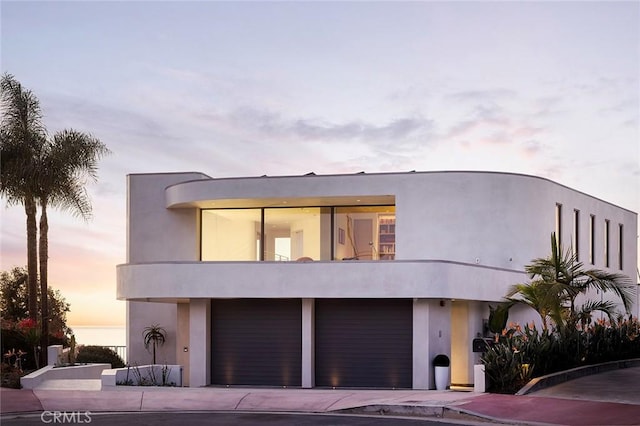 view of front of property with a garage