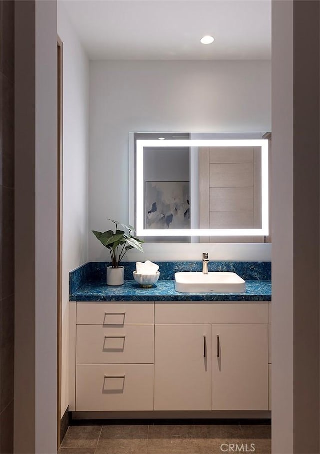 bathroom with vanity and tile patterned floors