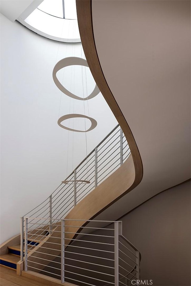 stairs with a skylight