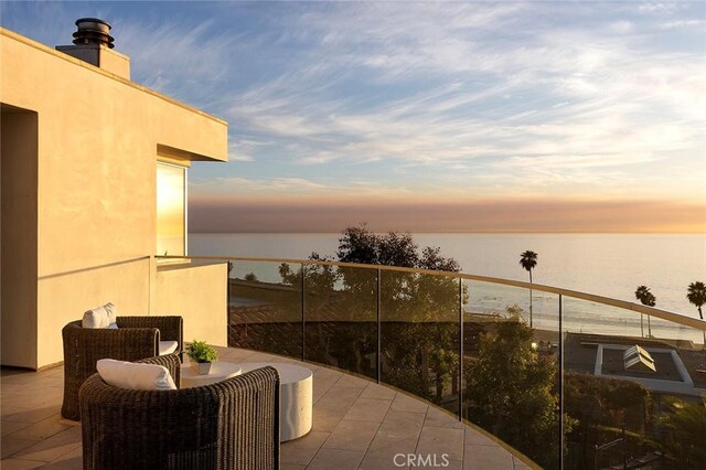 balcony at dusk with a water view