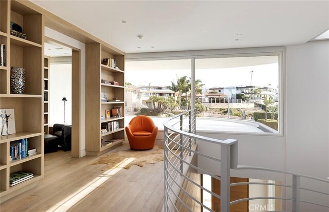 sitting room featuring wood-type flooring